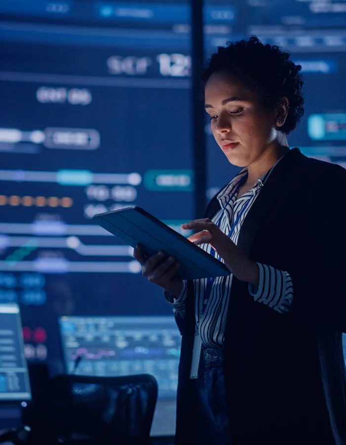 Woman working on a tablet in an IT department