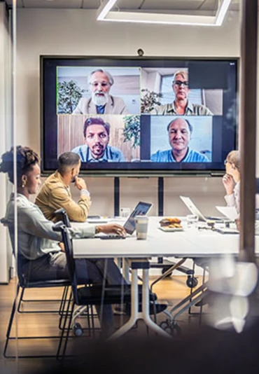 Virtual and in-person hybrid meeting in a conference room